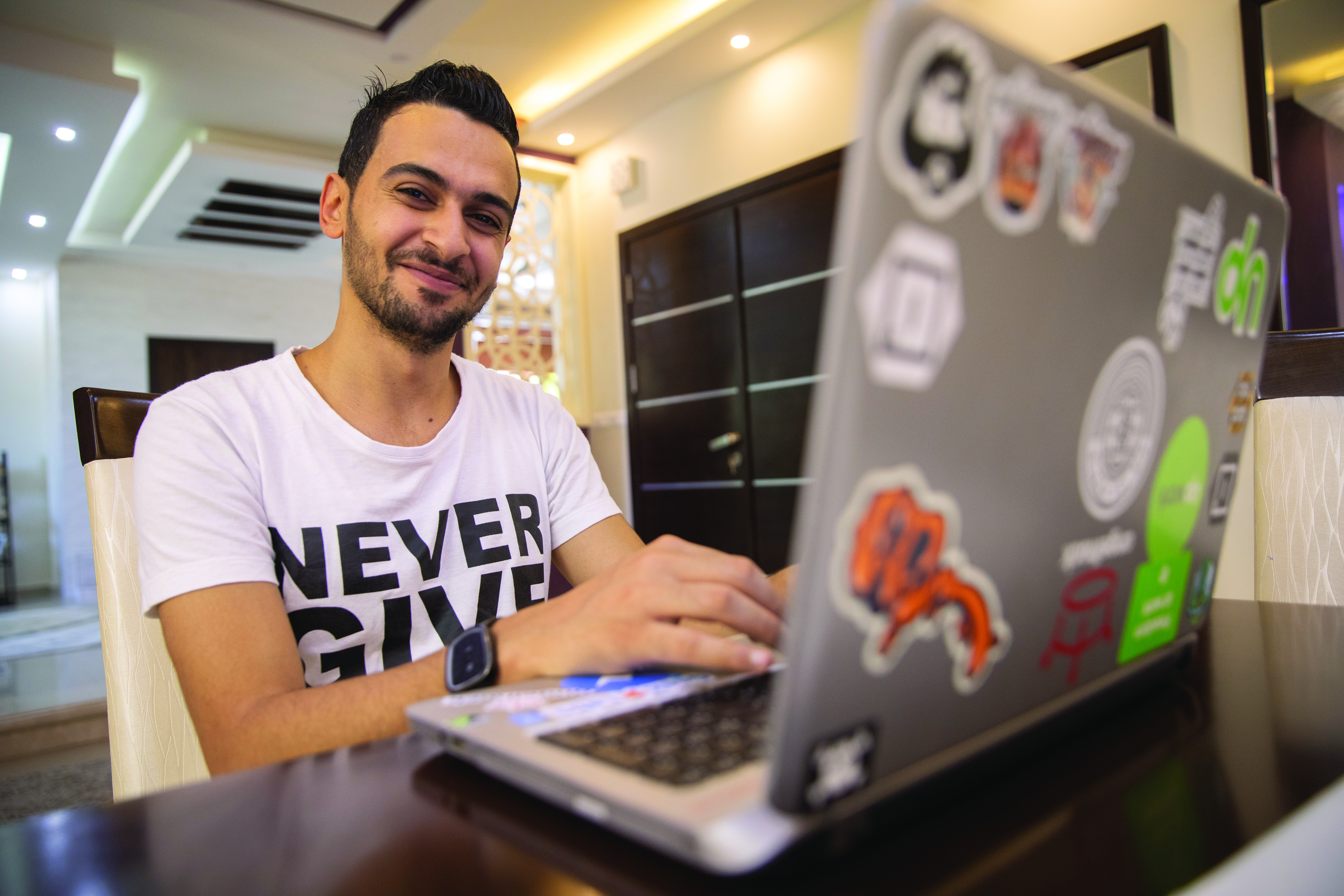 Young man in front of laptop.