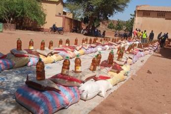 Program kits sit waiting for distribution in community area.